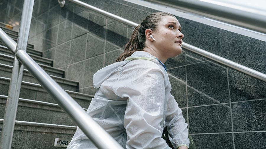 woman wearing earbuds